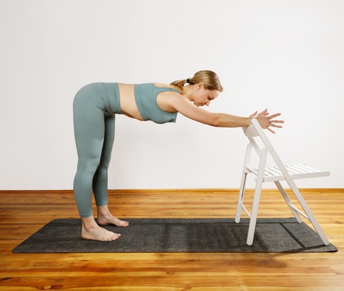 European,Blonde,Woman,Doing,Yoga,In,Green,Sportswear,Practices,Sports
